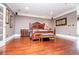 Spacious main bedroom featuring hardwood floors, recessed lighting, and an ensuite bathroom at 1050 Denton Rd, Douglasville, GA 30134