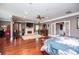 Main bedroom with hardwood floors, an ensuite fireplace, and french doors at 1050 Denton Rd, Douglasville, GA 30134