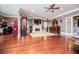 Main bedroom with hardwood floors, fireplace, ceiling fan, and a nearby office at 1050 Denton Rd, Douglasville, GA 30134