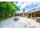 Expansive stamped concrete patio with fireplace, grill, and outdoor dining area perfect for entertaining at 1050 Denton Rd, Douglasville, GA 30134