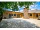 A spacious concrete patio showcases a beautiful stone fireplace and comfortable outdoor seating at 1050 Denton Rd, Douglasville, GA 30134