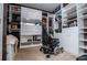 Organized walk-in closet with built-in shelving and cabinets for storage at 1050 Denton Rd, Douglasville, GA 30134