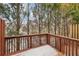 Inviting back deck perfect for entertaining outdoors with views of the trees at 2159 Meadow Peak Rd, Duluth, GA 30097