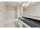 Bathroom features granite countertop, bath and shower combo, and vanity lighting at 2159 Meadow Peak Rd, Duluth, GA 30097