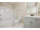 Clean bathroom with bath and shower combo, gray vanity, and large mirror at 2159 Meadow Peak Rd, Duluth, GA 30097