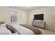 Comfortable bedroom featuring a large window, neutral walls, and cozy furnishings with modern decor at 2159 Meadow Peak Rd, Duluth, GA 30097