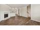 Bright and airy living room featuring a fireplace, hardwood flooring, and open layout with staircase at 2159 Meadow Peak Rd, Duluth, GA 30097