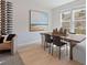 Elegant dining room with large window, stylish wine rack and modern decor at 3136 Washburn Se St, Atlanta, GA 30354