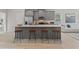 Kitchen with stainless appliances, counter with stools, and open to living area at 3136 Washburn Se St, Atlanta, GA 30354