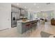 Bright, open kitchen featuring a large island with seating and stainless steel appliances at 3136 Washburn Se St, Atlanta, GA 30354