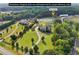 Expansive acreage showcasing the home, barn, and surrounding landscape, perfect for equestrian enthusiasts at 3480 Indian Shoals Rd, Dacula, GA 30019