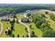 Expansive aerial view of a home, surrounded by mature trees and lush greenery at 3480 Indian Shoals Rd, Dacula, GA 30019