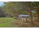 Barn and fenced pasture, perfect for equestrian activities and enjoying the peaceful countryside at 3480 Indian Shoals Rd, Dacula, GA 30019
