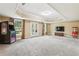 Large basement featuring an arcade game, popcorn machine, and a door to the outside at 3480 Indian Shoals Rd, Dacula, GA 30019