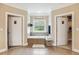 Bathroom with a soaking tub between and closets, and a window with a view at 3480 Indian Shoals Rd, Dacula, GA 30019