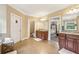 Bathroom with tile floor, dual vanities, private toilet room, and views to the bedroom at 3480 Indian Shoals Rd, Dacula, GA 30019