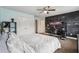 Cozy bedroom has a ceiling fan, a chalkboard wall, and a double door closet at 3480 Indian Shoals Rd, Dacula, GA 30019
