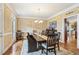 Elegant dining room with a spacious table, stylish chairs, and ample natural light at 3480 Indian Shoals Rd, Dacula, GA 30019