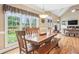 Bright dining room features large windows with views of the backyard at 3480 Indian Shoals Rd, Dacula, GA 30019
