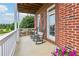 Relaxing porch with rocking chairs and a view, perfect for enjoying the serene surroundings at 3480 Indian Shoals Rd, Dacula, GA 30019