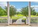 Picturesque view of front yard with manicured landscaping and winding driveway at 3480 Indian Shoals Rd, Dacula, GA 30019