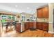 Modern kitchen boasts stainless steel appliances, granite countertops and a view to the dining area at 3480 Indian Shoals Rd, Dacula, GA 30019