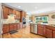 Well-equipped kitchen featuring modern stainless steel appliances and hardwood floors at 3480 Indian Shoals Rd, Dacula, GA 30019