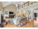 Spacious living room with a fireplace, hardwood floors, and stylish decor at 3480 Indian Shoals Rd, Dacula, GA 30019