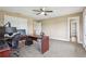 Large office with ceiling fan, carpet, walk-in closet, and plenty of space for multiple monitors at 3480 Indian Shoals Rd, Dacula, GA 30019