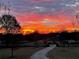 Stunning sunrise view overlooking the estate's driveway and landscaping at 3480 Indian Shoals Rd, Dacula, GA 30019