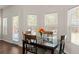 This breakfast nook has a door to the outside and three windows letting in lots of light at 403 Sonja Ln, Loganville, GA 30052