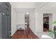 Welcoming entryway with hardwood floors and neutral paint colors, leading to the kitchen and dining area at 403 Sonja Ln, Loganville, GA 30052