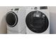 This is a laundry room showing a GE washer and dryer set at 403 Sonja Ln, Loganville, GA 30052