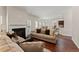 The living room has a fireplace and leads into a breakfast nook and a kitchen with a breakfast bar at 403 Sonja Ln, Loganville, GA 30052