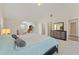 This main bedroom is spacious and well lit, with two doorways, a sitting area, and neutral paint at 403 Sonja Ln, Loganville, GA 30052