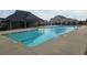 Community pool with plenty of deck space, a splash pad, and a covered pavilion at 403 Sonja Ln, Loganville, GA 30052