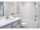 A clean, minimalist bathroom with modern fixtures and a shower-tub combo at 710 Elmwood Way, Roswell, GA 30075