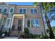 Charming two-story home with a well-manicured front yard and inviting entrance at 710 Elmwood Way, Roswell, GA 30075