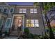 Charming two-story home with a well-manicured front yard and inviting entrance at 710 Elmwood Way, Roswell, GA 30075