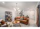 Inviting living room area with modern decor, cozy seating and a stylish bookshelf at 710 Elmwood Way, Roswell, GA 30075