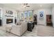 Bright living room with fireplace, built-ins, and an inviting entryway with coat racks and storage at 710 Elmwood Way, Roswell, GA 30075