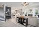 Open-concept living area showcases an inviting layout with a modern fireplace and seamless kitchen access at 710 Elmwood Way, Roswell, GA 30075