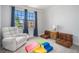 Playroom with comfortable seating and great natural light at 710 Elmwood Way, Roswell, GA 30075