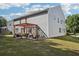 Wide backyard showcasing a pergola-covered patio and generous lawn space at 1017 Preserve Park Dr, Loganville, GA 30052