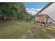 Spacious backyard featuring a pergola-covered patio and ample green space for outdoor activities at 1017 Preserve Park Dr, Loganville, GA 30052