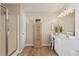 Bright bathroom featuring a walk-in shower, single vanity, and wood-look floors at 1017 Preserve Park Dr, Loganville, GA 30052