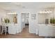 Spacious bathroom with dual vanities, white cabinets, and wood-look floors at 1017 Preserve Park Dr, Loganville, GA 30052