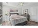 Bright bedroom featuring a ceiling fan, a comfortable bed, and tasteful decor at 1017 Preserve Park Dr, Loganville, GA 30052