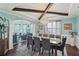 Elegant dining room boasting a large table, stylish chandelier, and abundant natural light at 1017 Preserve Park Dr, Loganville, GA 30052