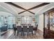 Elegant dining room boasting a large table, stylish chandelier, and abundant natural light at 1017 Preserve Park Dr, Loganville, GA 30052